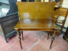 A LATE 19th/EARLY 20th CENTURY POLISHED AND MAHOGANY FOLDOVER TEA TABLE having an oblong top with