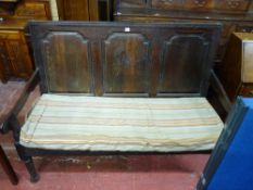 A LATE 18th/EARLY 19th CENTURY OAK BENCH with triple chamfered shaped panel back and shaped side