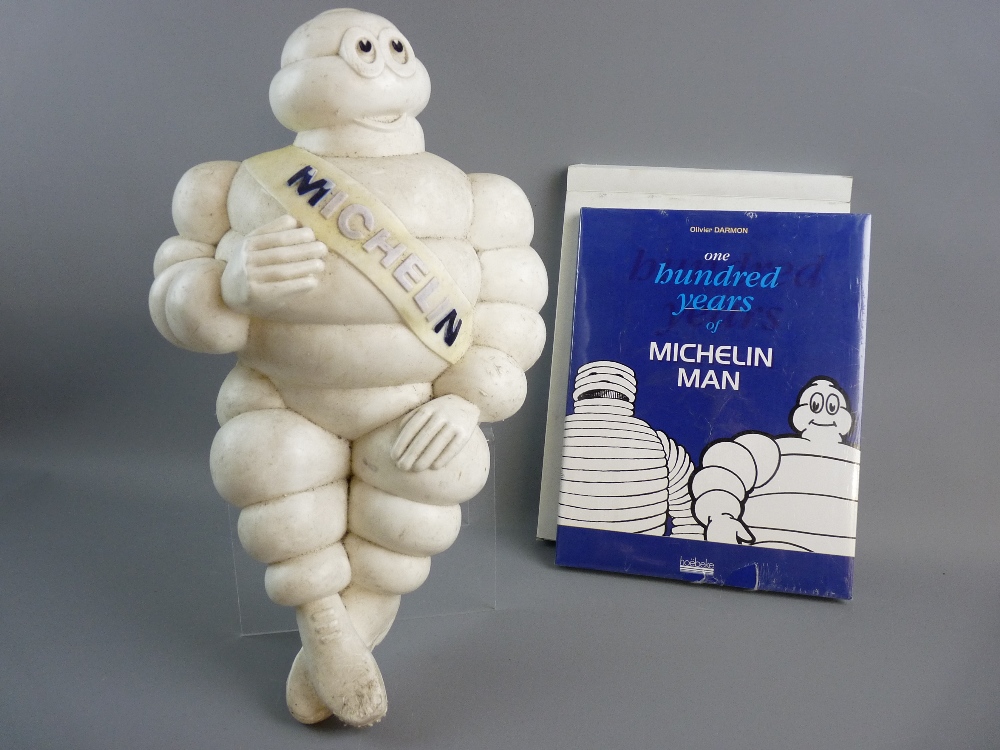 A MICHELIN MAN BIBENDUM moulded advertising figure, the seated 46 cms figure with Michelin sash