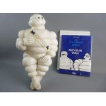 A MICHELIN MAN BIBENDUM moulded advertising figure, the seated 46 cms figure with Michelin sash