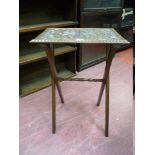 A SMALL OAK FOLDING TABLE with a carved top and turned centre stretcher