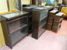 FOUR GLOBE WERNICKE STYLE POLISHED BOOKCASES each having three glass fronted doors and a pair of