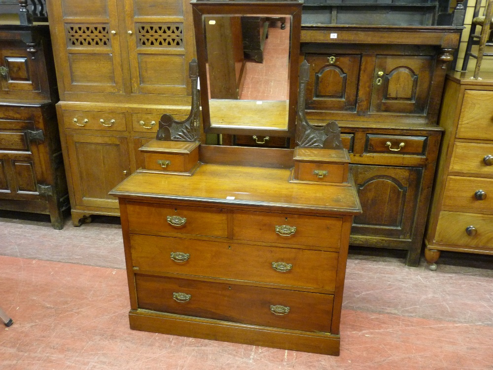 AN EDWARDIAN MAHOGANY DRESSING TABLE with two long and two short drawers