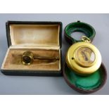 A HARRODS LIMITED GILT BRASS CASED TRAVEL COMPASS AND BAROMETER in original fitted case along with