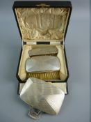 A HALLMARKED SILVER CASED BRUSH AND MIRROR SET to include a stylish finger and thumb held