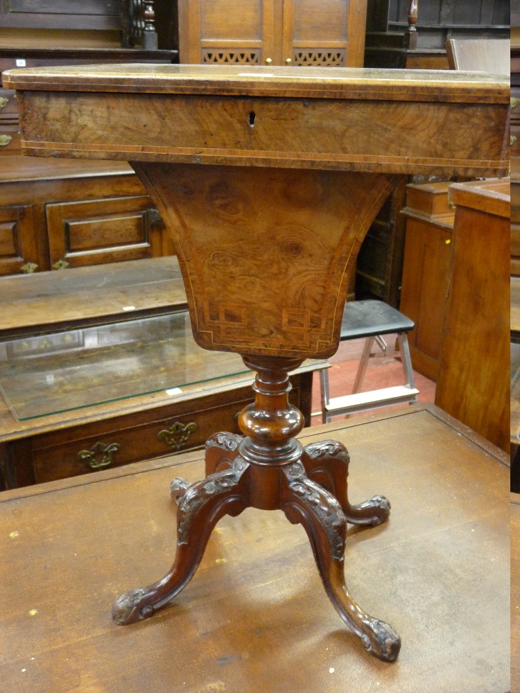 A VICTORIAN WALNUT SEWING TABLE, oblong topped with compartmented interior and recess to four