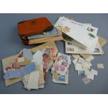 A JACOB'S BISCUIT TIN OF LOOSE STAMPS, an envelope of similar and a small quantity of first day