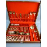 A MID CENTURY OAK CASED CANTEEN OF CUTLERY, red lined interior containing seventy eight pieces of