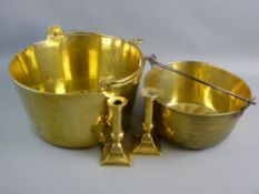 A VICTORIAN BRASS PRESERVE PAN and one other, 32 cms diameter with brass swing handle and a 25.5 cms