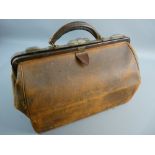 A MEDIUM SIZED LEATHER GLADSTONE BAG bearing a 'Southern Railway to Charing Cross' label