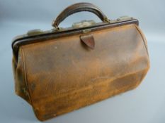 A MEDIUM SIZED LEATHER GLADSTONE BAG bearing a 'Southern Railway to Charing Cross' label