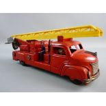 A TINPLATE CLOCKWORK FIRE ENGINE with six seated figures and dinging bell action, 30 cms long,