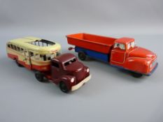 TWO GERMAN TINPLATE CLOCKWORK VEHICLES including a Heinrich Wimmer HWN-1950 bus, bakelite cab