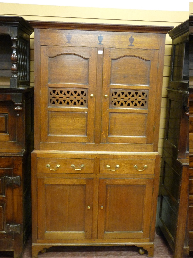 A FINE ANTIQUE WELSH OAK TWO PIECE BREAD AND CHEESE CUPBOARD, the upper section having a top panel