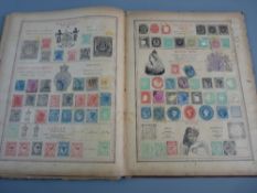 AN EARLY HEITMANN'S POSTAGE STAMP ALBUM, fourth edition, sparsely filled but Great Britain having