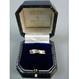 A NINE CARAT GOLD DOUBLE BAND DRESS RING with tiny diamonds, 2.6 grms