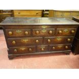 A GEORGE IV OAK AND CROSSBANDED MAHOGANY LANCASHIRE MULE CHEST, the moulded top with shallow