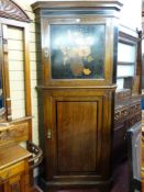 A WARING & GILLOW MAHOGANY AND CROSSBANDED TWO PIECE STANDING CORNER CUPBOARD having a stepped