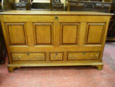 A 19th CENTURY OAK AND CROSSBANDED MAHOGANY MULE CHEST, the three plank lift-up lid with bull nose