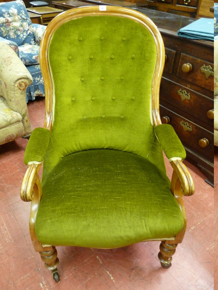A MAHOGANY FRAMED VICTORIAN OPEN ARMCHAIR with green dralon button backed upholstery and on turned