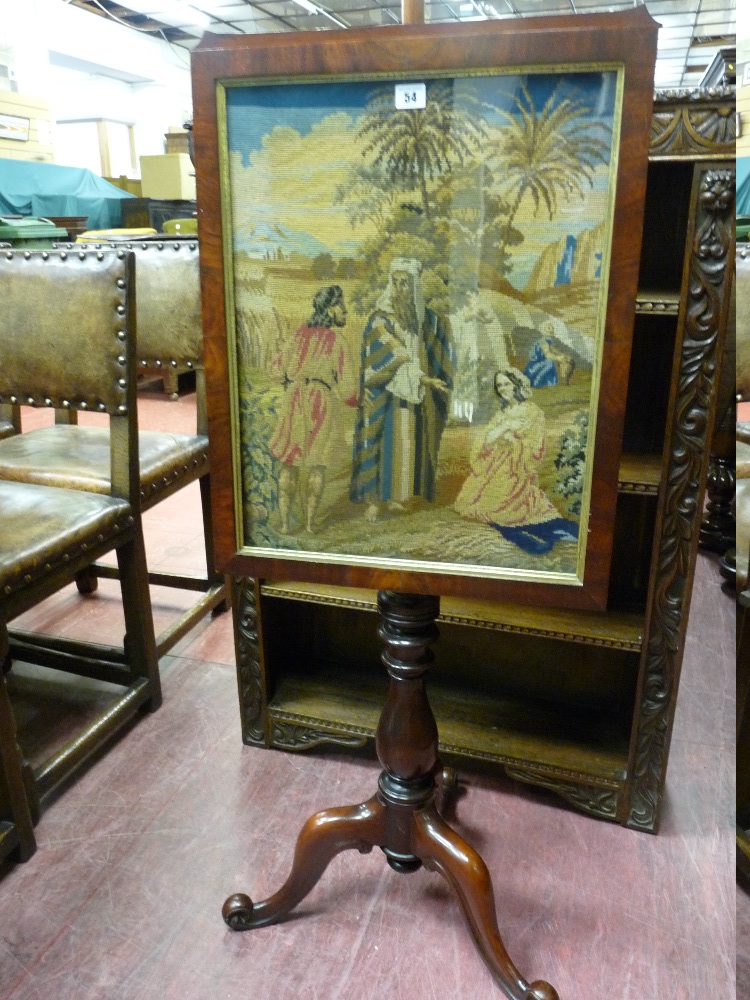 A VICTORIAN MAHOGANY TAPESTRY POLESCREEN with turned centre pedestal on tripod and scrolled