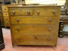 A 19th CENTURY OAK CHEST of three long and two short drawers with turned wooden knobs, 112 cms wide