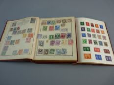 A TRIUMPH ILLUSTRATED STAMP ALBUM sparsely filled and a nicely filled hard cover Ace stamp album,