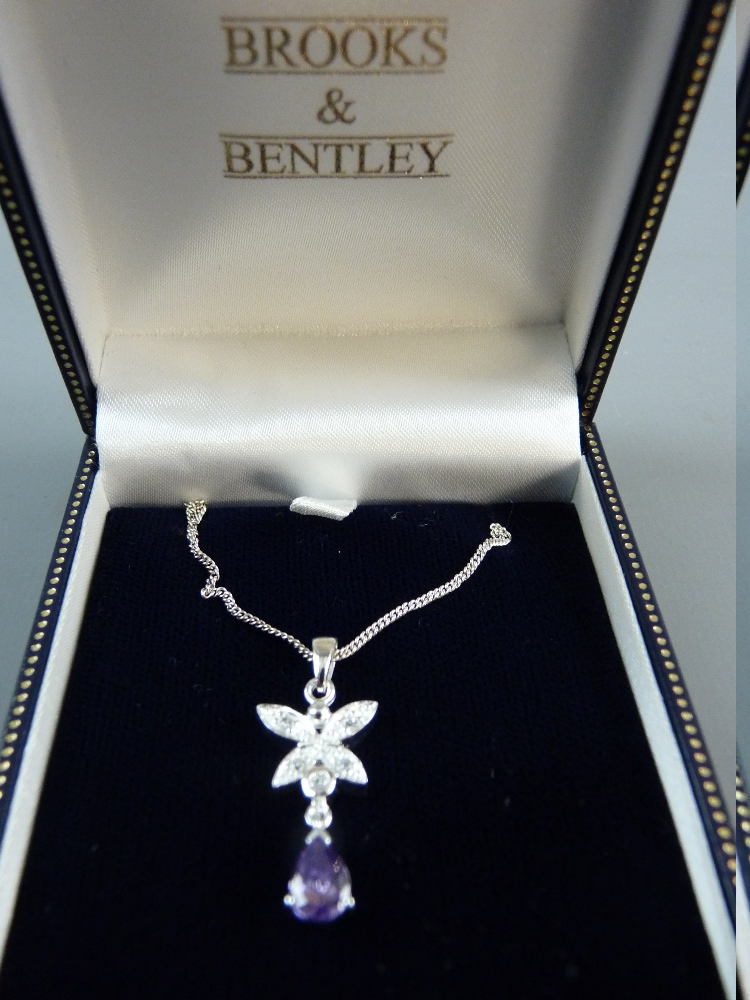 A 925 SILVER NECK CHAIN with floral diamond and pink stone pendant by Brooks & Bentley, 4.5 grms