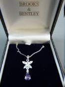 A 925 SILVER NECK CHAIN with floral diamond and pink stone pendant by Brooks & Bentley, 4.5 grms