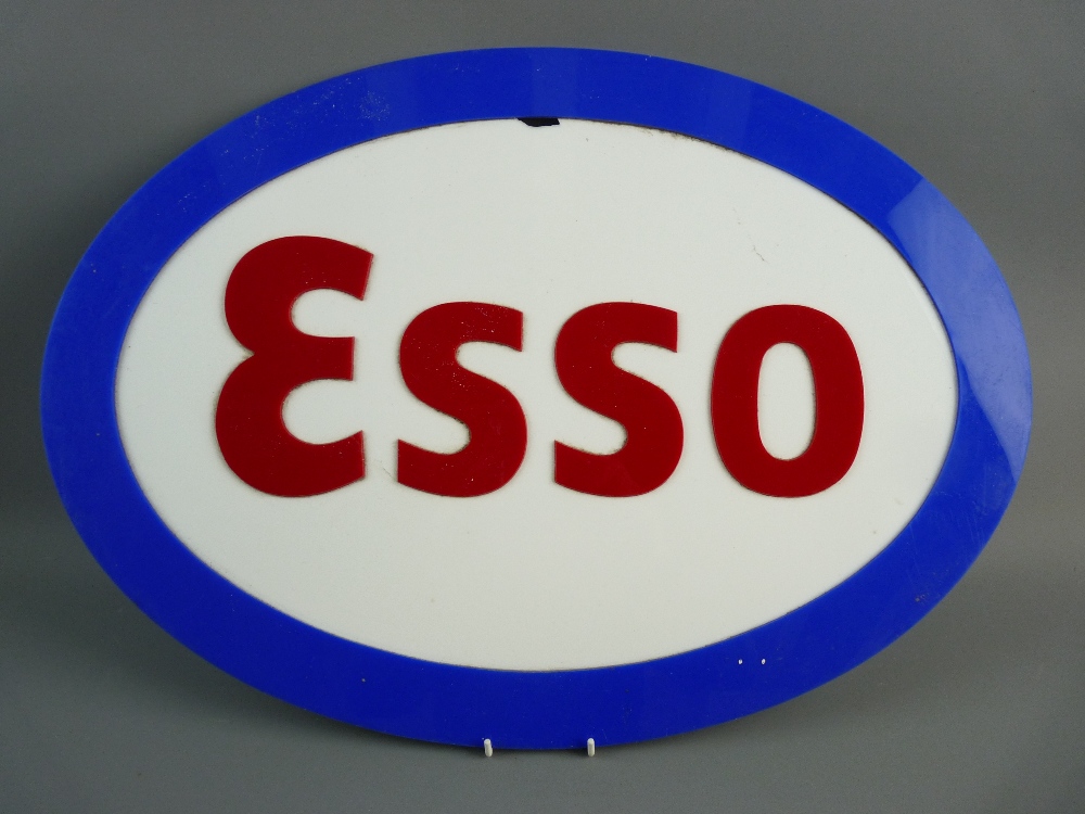 A PERSPEX OVAL ESSO GARAGE SIGN, 60 cms wide approximately (slight damage within the white area)