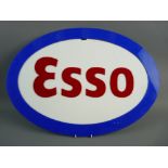 A PERSPEX OVAL ESSO GARAGE SIGN, 60 cms wide approximately (slight damage within the white area)