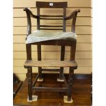 A LATE 18th/EARLY 19th CENTURY CHILD'S OAK HIGH ARMCHAIR, the rectangular top rail over four