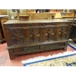AN 18th CENTURY OAK MULE CHEST, the twin plank top having moulded edge with Jacobean panelled