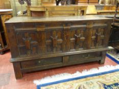 AN 18th CENTURY OAK MULE CHEST, the twin plank top having moulded edge with Jacobean panelled