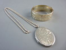 A LADY'S ENGRAVED WIDE SILVER BRACELET, half bright cut with floral decoration, 1 oz and a large