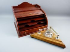 A VINTAGE OAK DESK STAND and reproduction mahogany stationery cabinet, the triangular desk stand