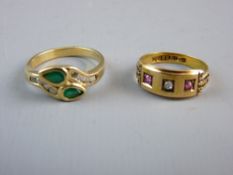 A FOURTEEN CARAT GOLD CROSSOVER DRESS RING with two tear drop emeralds and tiny flanking diamonds,