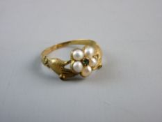 AN UNMARKED GOLD RING, the five centre pearls and tiny centre stone set and 'held' by two