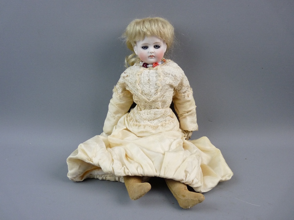 A FRENCH BISQUE PORCELAIN HEADED DOLL with blue eyes and closed mouth having painted detail, circa