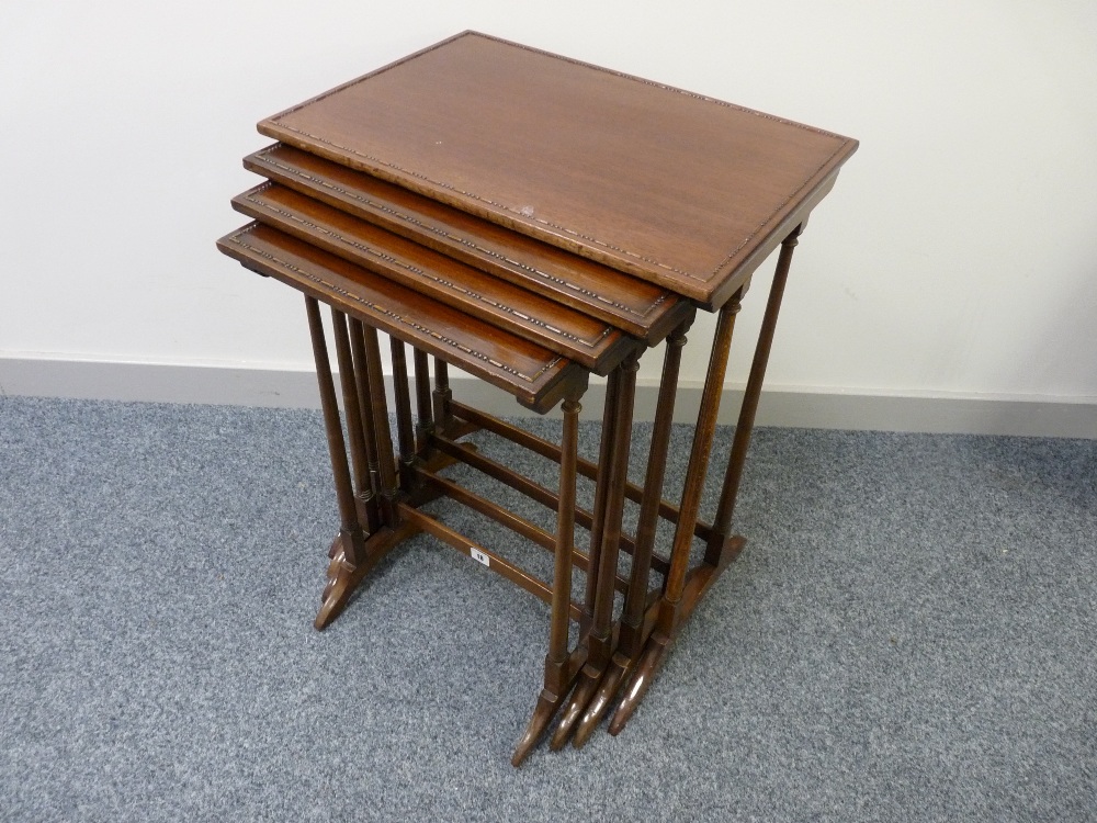 AN EDWARDIAN QUARTETTO OF MAHOGANY TABLES with beaded top decoration, turned slender supports and