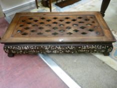 A LATE 19th CENTURY CARVED EASTERN HARDWOOD COFFEE TABLE, the top with pierced diamond decoration,