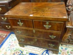 A SMALL MAHOGANY CHEST of two short over two long drawers on ogee bracket corner feet, the cock