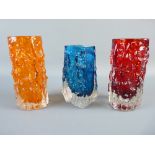 THREE WHITEFRIARS GLASS BARK VASES by Geoffrey Baxter, two cylindrical in tangerine and ruby red