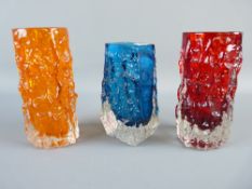 THREE WHITEFRIARS GLASS BARK VASES by Geoffrey Baxter, two cylindrical in tangerine and ruby red