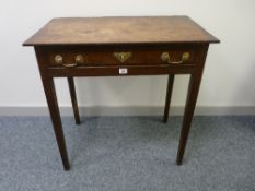 AN ANTIQUE OAK SINGLE DRAWER SIDE TABLE having a shallow crossbanded top and drawer, cock beaded