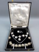 A CASED FILIGREE SILVER JEWELLERY SET of necklace, bracelet, brooch and earrings