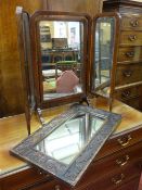A MAHOGANY FRAMED TRIPLE DRESSING MIRROR and a carved oak wall mirror, 68.5 and 65 cms high