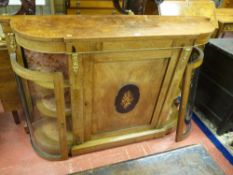 A VICTORIAN WALNUT BOWED CREDENZA with gilt metal embellishments, the shaped top over a central