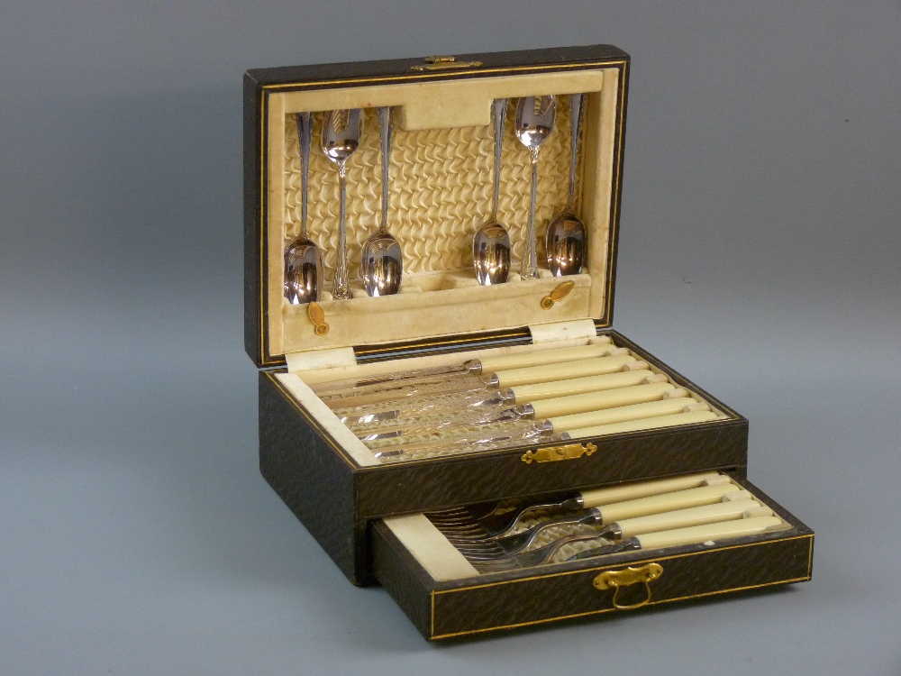 A QUALITY CASED ELECTROPLATE DESSERT SET of six knives, six forks and six spoons in a fitted