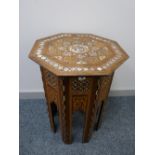 AN EASTERN INLAID OCTAGONAL TOP TABLE, multi-wood and mother of pearl inlaid, geometric and scroll